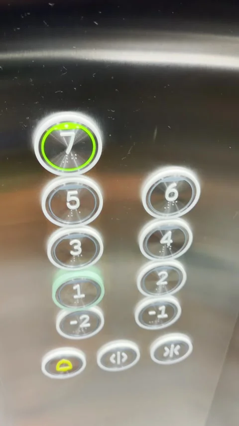 Personal perspective of person entering elevator or lift and presses button to Stock Footage 345181944