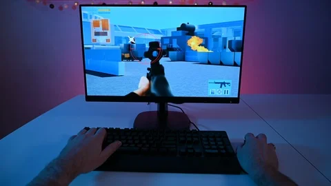 Personal perspective from player who plays a video game on a computer screen Stock Footage 100798329
