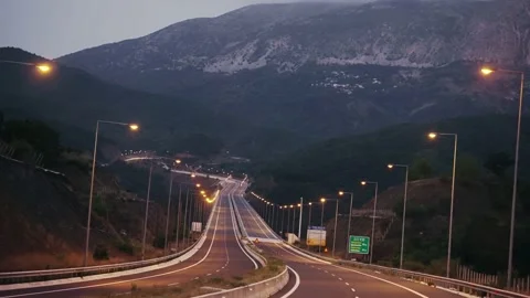 Personal perspective of speedy road drive along the evening highway at twilig Stock Footage 237033142