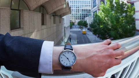 Personal perspective time-lapse of a caucasian businessman checking the time Video stock 104037511