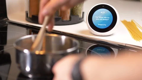 Personal Smart Assistant Making a Shopping List While Cooking Stock Footage 94031329