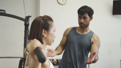 Personal Trainer Assisting with Weight Training 스톡 동영상 293431881