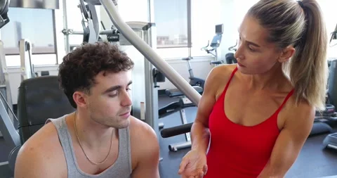 Personal Trainer Coaching at the Gym Video stock 323776472