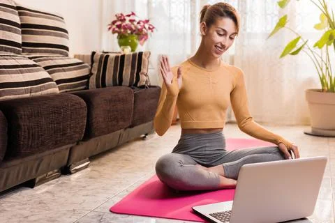 Personal trainer entering with laptop computer in a virtual classroom video Stock Photos