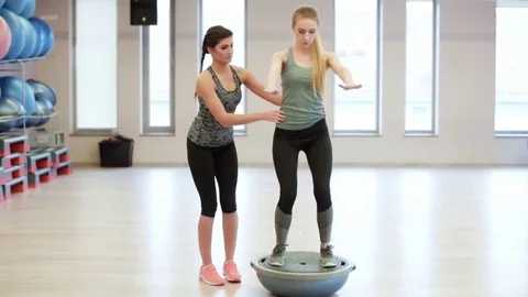Personal trainer with female training  Video stock 76600963