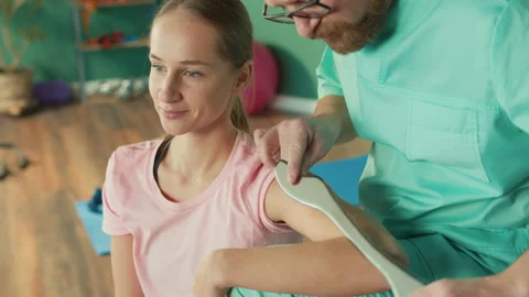 The Personal Trainer Gives the Athlete a Massage to Restore Physical Functions Video stock 171138341
