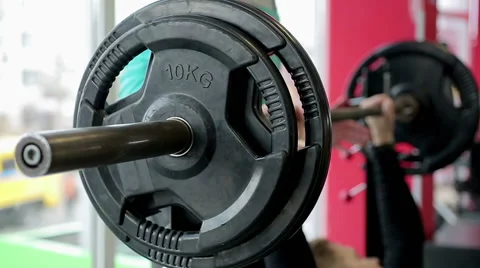 Personal trainer helping beginner athlete to do bench press exercise, workout Stock Footage 60825405