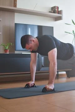 Personal trainer men doing push-up exercises for a lesson at home 스톡 사진