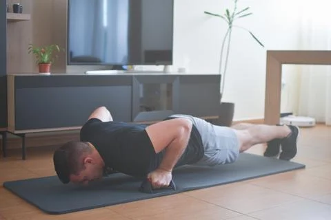 Personal trainer men doing push-up exercises for a lesson at home 스톡 사진