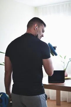 Personal trainer men using a pc for a lesson at home 스톡 사진