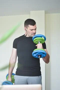 Personal trainer men using a pc for a lesson at home Stock Photos