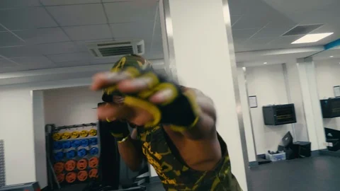 Personal trainer sparring and shadow boxing to camera, action shot slow mo Stock Footage 89577579