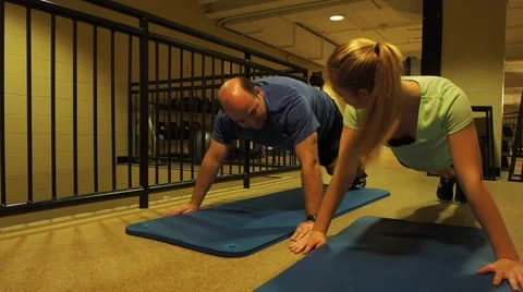Personal trainer teaching to a person about exercise Stock Footage 45519481