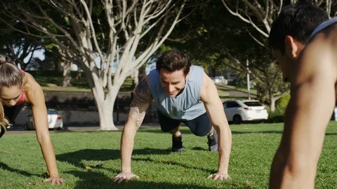 Personal trainer training an attractive young couple Stock Footage 86888002