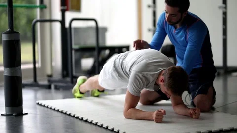 Personal Trainer with young man Stock Footage 119175246