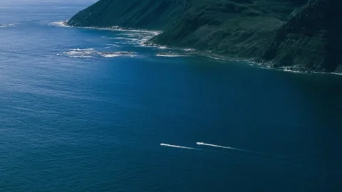 Personal watercraft crossing open ocean off Hout Bay, aerial view Stock Footage 340554629