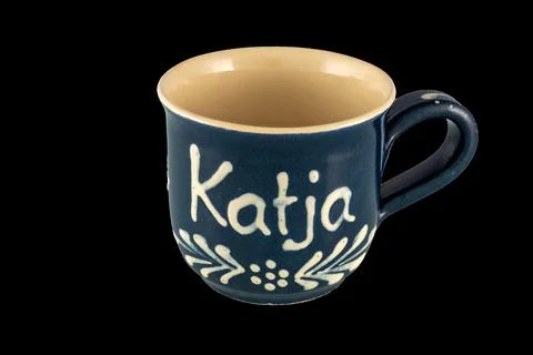 Personalized Blue Ceramic Mug With Name Katja and Decorative White Floral P.. Stock Photos
