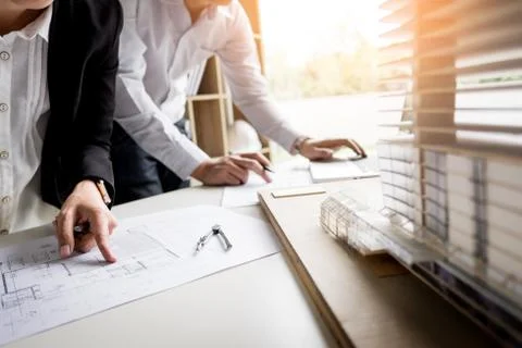 Person's engineer Hand Drawing Plan On Blue Print with architect equipment Fotos de archivo