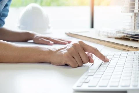 Person's engineer Hand Drawing Plan On Blue Print or working project in his o Fotos de archivo