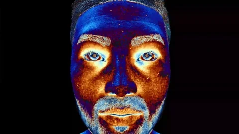 A person's face pulses with all the colours of the rainbow and symbolises a deep Stock Footage 242306153