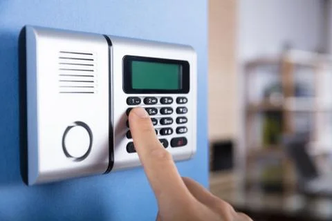 Person's Finger Entering Code In Security System Foto stock