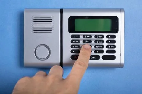 Person's Finger Entering Code In Security System 스톡 사진