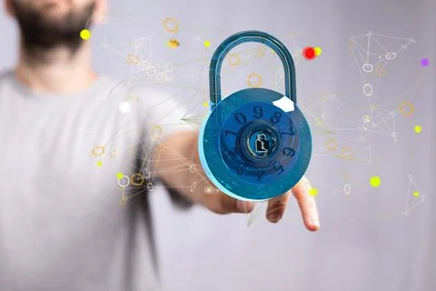 Person's finger touching a 3D rendered security concept with floating padlock an Stockfoto's