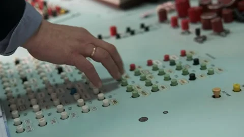 A person's hand on a control panel in a control room Stock Footage 329179063