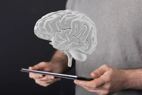 Person's hand holding a tablet with 3D rendered Artificial Intelligence 写真素材