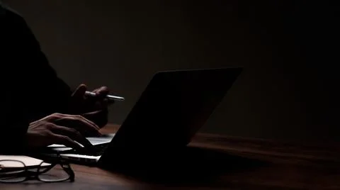 A person's hand is pressing a computer keyboard to make it easier to work. Pu Stock Photos
