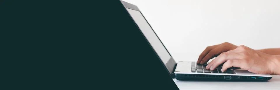 A person's hand is pressing a computer keyboard to make it easier to work. .. Stock Photos