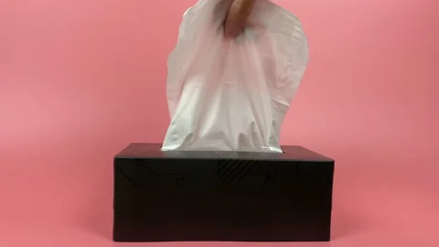 A person's hand pull out a piece of tissue from tissue paper box isolated. 動画素材 201365918