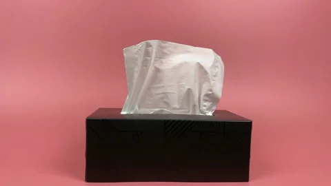 A person's hand pull out a piece of tissue from tissue paper box isolated. Stock Footage 201366560