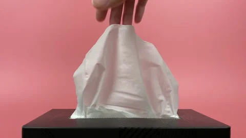 A person's hand pull out a piece of tissue from tissue paper box isolated. Stock Footage 201369116