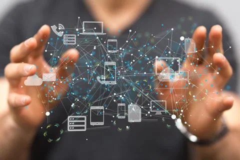 Person's hand reaching to 3D rendered devices and files connected to each oth Foto stock