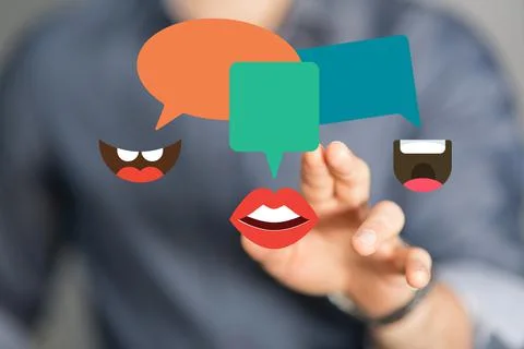 Person's hand reaching to 3D rendered speech bubble icons Stock Photos
