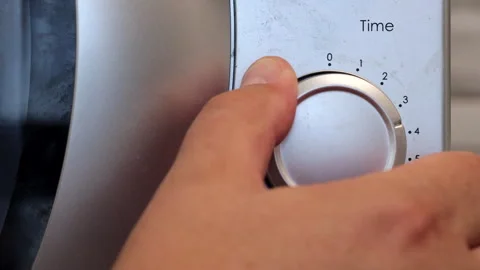 A Person's Hand Sets The Microwave Oven's Operating Time To Four Minutes Video stock 262074423
