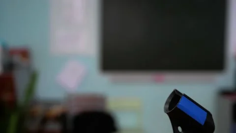 A person's hand takes the microphone from the microphone stand then puts the Stock Footage 170485849