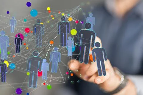 Person's hand touching 3D rendered people silhouettes in the network team Fotos de archivo