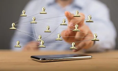 Person's hand touching 3D rendered people silhouettes in the network team Stock Photos
