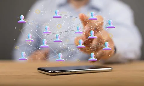 Person's hand touching 3D rendered people silhouettes in the network team Fotos de archivo