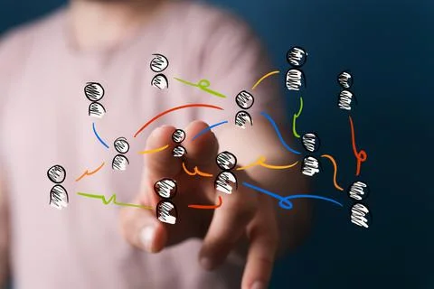 Person's hand touching 3D rendered people silhouettes Fotos de archivo