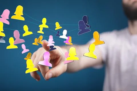 Person's hand touching 3D rendered people silhouettes Fotos de archivo