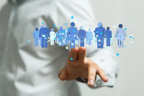 Person's hand touching 3D rendered people silhouettes Fotos de archivo