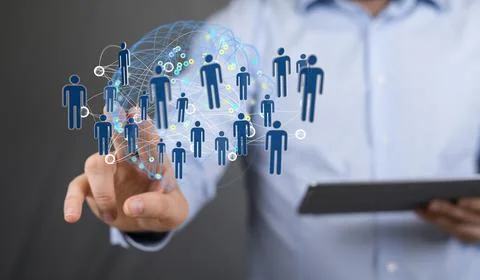 Person's hand touching the 3D rendered people silhouettes in the network team Fotos de archivo