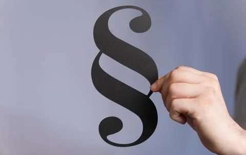 Person's hand touching a 3D rendered section sign Stock Photos