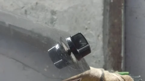 A persons hand is turning the knob of a gas stove Stock Footage 324941966