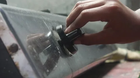 A persons hand is turning the knob of a gas stove Stock Footage 324942004