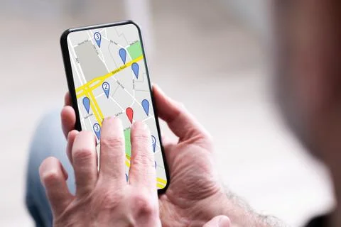 Person's Hand Using GPS Navigation Map Stock Photos