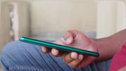 Person's Hand Using A Smartphone. Video stock 171386965